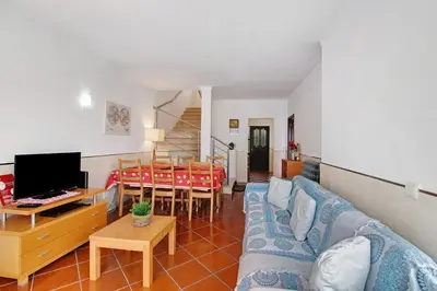 a dining room with a table and chairs at Oura Southvilla Algarve in Albufeira