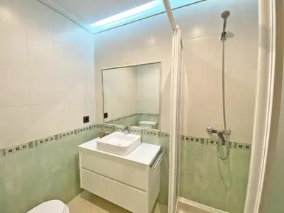 a bathroom with a sink and a shower at Fantastic Villa, Private Pool, BBQ, AC and Wi-Fi in Quarteira