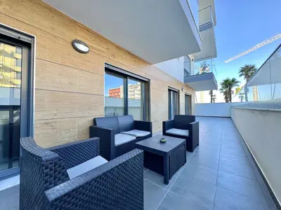 a patio with two chairs and a table on a building at Faro Prestige by Homing in Faro