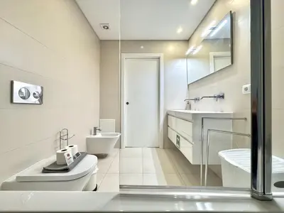 a white bathroom with a sink and a toilet at Faro Prestige by Homing in Faro