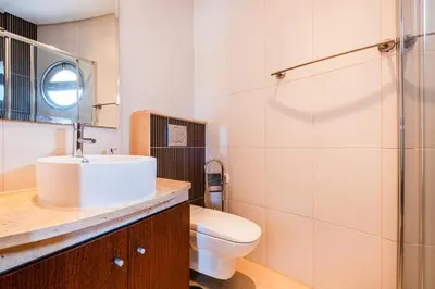 a bathroom with a sink and a toilet at Capetown Marina Luxury Villa - Private Pool in Albufeira