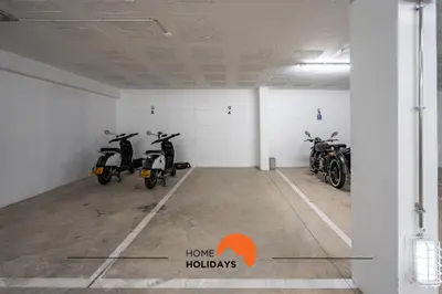 a room with three motorcycles parked in it at #234 Serenity Refuge w Balcony and Pool in Albufeira