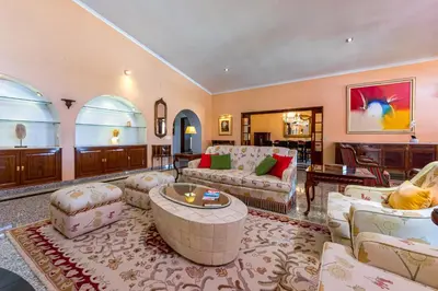 a living room with couches and a table at Villa Sobreiro in Albufeira