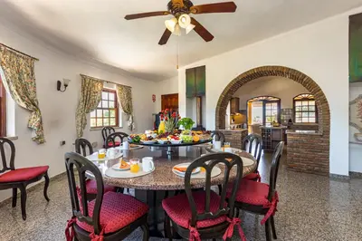 a dining room with a table and chairs at Villa Sobreiro in Albufeira