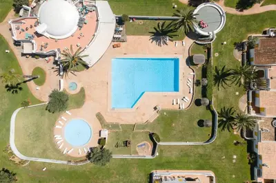 an overhead view of a swimming pool in a park at Villa Blue - Aldeia do Golfe in Quarteira