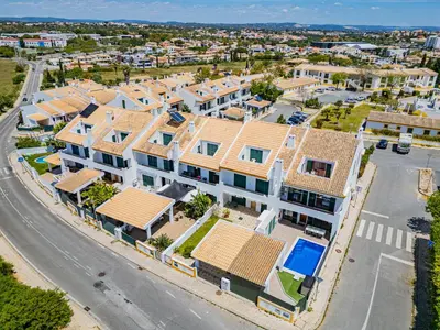 an aerial view of a residential neighbourhood with houses at Villa Gil in Albufeira