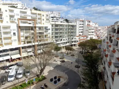 an aerial view of a city with tall buildings at Apartamento Avenida da Liberdade in Albufeira