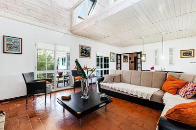 a living room with a couch and a table at Villa Oliva - Maison 6 chambres in Vilamoura