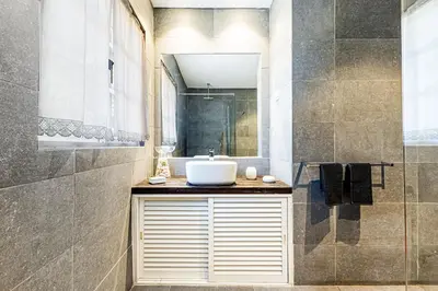 a bathroom with a sink and a shower at Villa Oliva - Maison 6 chambres in Vilamoura
