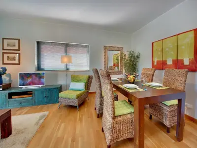 a dining room with a table and chairs at Marina Sea Residence in Albufeira