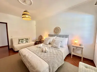 a bedroom with a bed with two stuffed animals on it at Vilamoura White House Villa With Pool by Homing in Vilamoura