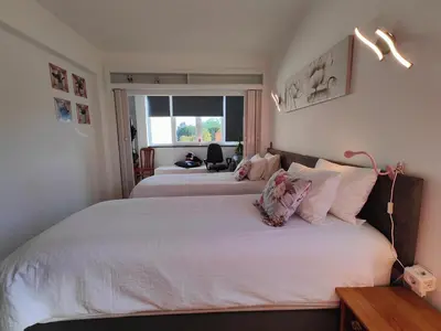 a bedroom with two beds with white sheets and a window at Happy&Roses, Vilamoura, pool&golf in Vilamoura