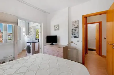 a bedroom with a large bed and a television at Happy&Roses, Vilamoura, pool&golf in Vilamoura