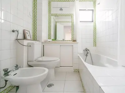 a bathroom with a toilet and a tub and a sink at Albufeira Boho Apartment in Albufeira