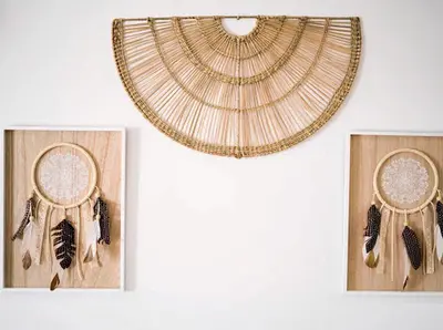 three framed pictures of a dream catcher with feathers at Albufeira Boho Apartment in Albufeira