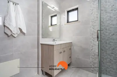 a bathroom with a sink and a shower with a mirror at #232 Vila Girasol 33 by Home Holidays in Albufeira