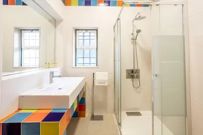 a bathroom with a sink and a shower at Villa Moura by HelloVacations in Loulé