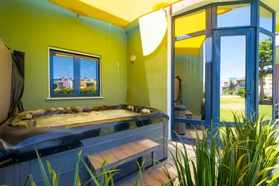 a house with a jacuzzi tub in a room at Romantic with private Hot Tub & Parking - big pool - Marina access in Albufeira