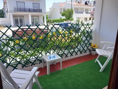 a balcony with a fence and a table and chairs at Apartamento Briza by Sunnyway in Albufeira