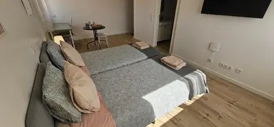 a bedroom with a large bed with pillows at Ideal Bubble House in Faro