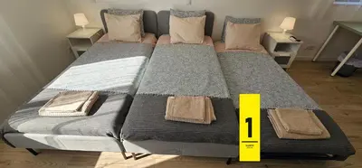 a large bed with a yellow measuring tape on it at Ideal Bubble House in Faro