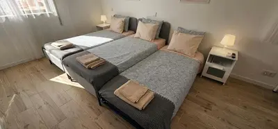 two beds in a small room with two at Ideal Bubble House in Faro