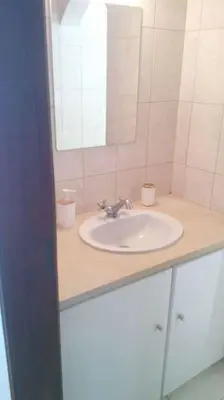 a bathroom with a sink and a mirror at Color me Happy - 2 bedrooms apartment near Forum Algarve in Faro