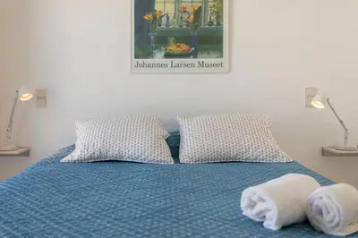 a bedroom with a bed with towels on it at TAC - Windmill OceanFront Villa in Albufeira