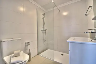 a bathroom with a shower and a toilet and a sink at Old Town Gem by Atlantic Places in Albufeira