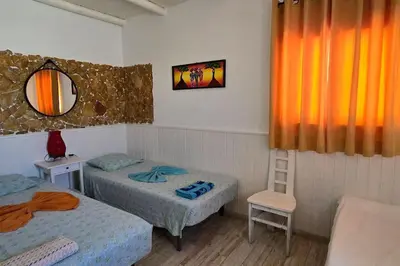 a small room with two beds and a mirror at Villa Ania - Private Villa with pool&Jacuzzi, 16 to 40 pax in Albufeira