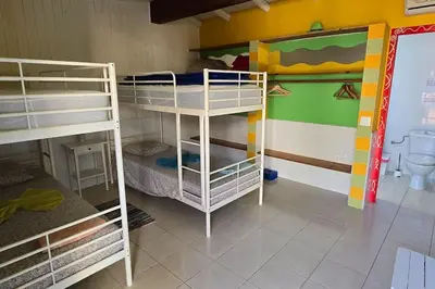 a room with two bunk beds and a bathroom at Villa Ania - Private Villa with pool&Jacuzzi, 16 to 40 pax in Albufeira