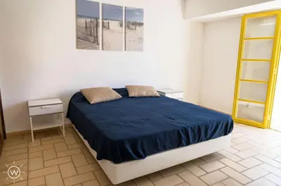 two beds with blue cushions in a room at Da Vinci Villa Salgados-Guia-Algarve in Albufeira
