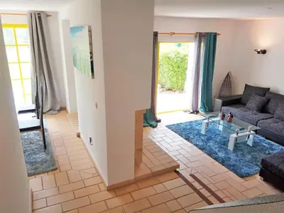 a living room with a couch and a table at Sunshine Villa Salgados Guia Algarve in Albufeira