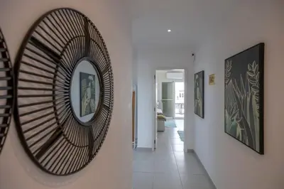 a hallway with a large mirror on the wall at Villa Le petit charme in Albufeira