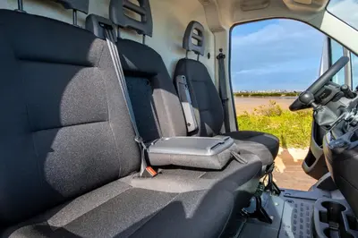 a room with blue bean bags and a window at Ocean Camper - Campervan & Surf rentals in Faro