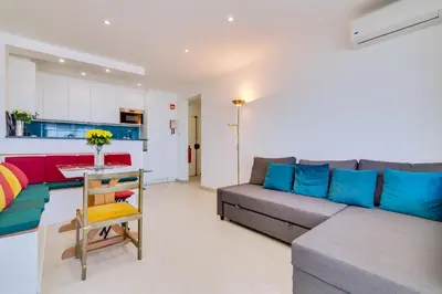 a living room with a couch and a table at 2bdr Sea View Miravila Apartment in Quarteira in Quarteira