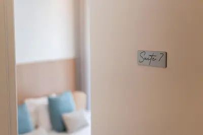 a door with a sign that says sit on it at Madalena Hostel e Suites in Faro