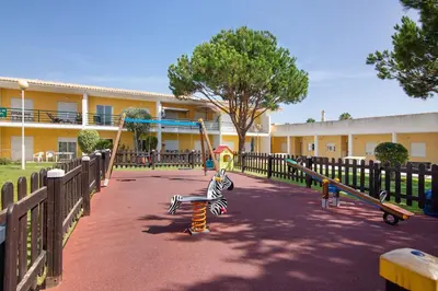 a playground with a zebra on a swing at Encosta São José in Guia