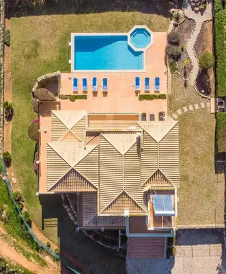 an aerial view of a house with a swimming pool at Villa Água in Albufeira