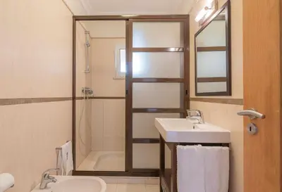 a bathroom with a sink and a shower at Villa Costa in Albufeira