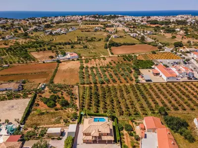 an aerial view of a village with houses and the ocean at Villa Hunês in Guia
