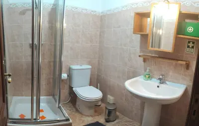 a bathroom with a shower and a toilet and a sink at Apt 3 Quartos, Terraço, Centro, Prestige For Home in Loulé