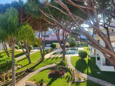 an aerial view of a park with trees and a pool at T2 Falésia - Olhos de Água in Olhos de Água