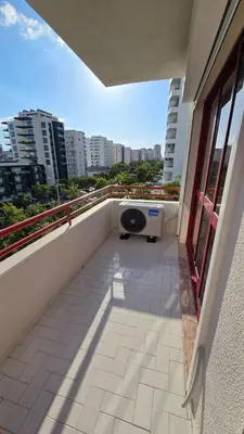 a balcony with a speaker on the side of a building at Nice Flat in Quarteira Beach in Quarteira
