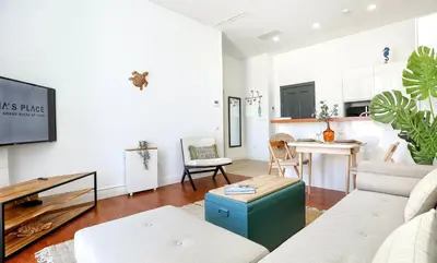 a living room with a couch and a table at Maison Faro Luxe - A Tranquil Retreat by the Algarve Coast in Faro