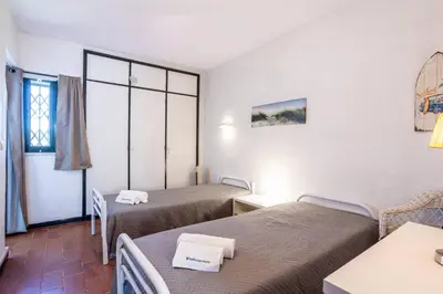 a hotel room with two beds and a window at Azure Vilamoura Apartment by HelloVacations in Loulé