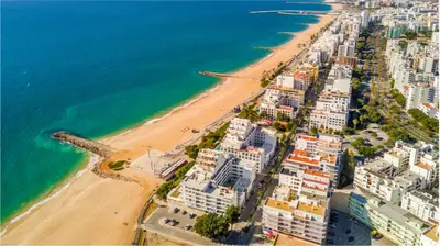 an aerial view of a beach and the ocean at Amazing Flat, 100m from beach in Quarteira