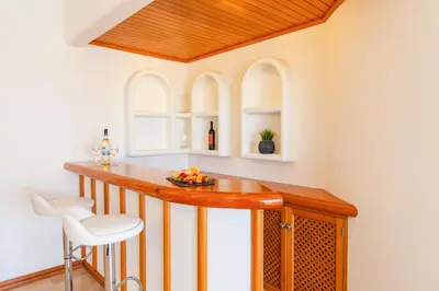 a kitchen with a counter and a table in a room at Villa Serena by Algarve Vacation in Guia