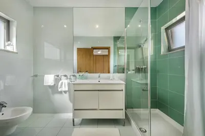 a bathroom with a sink and a shower at Blue by Algarve Villa Holidays in Albufeira