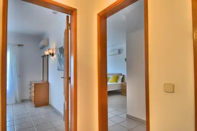 a hallway with a door leading to a bedroom at Villa Santa Maria Valley - Private Pool in Albufeira